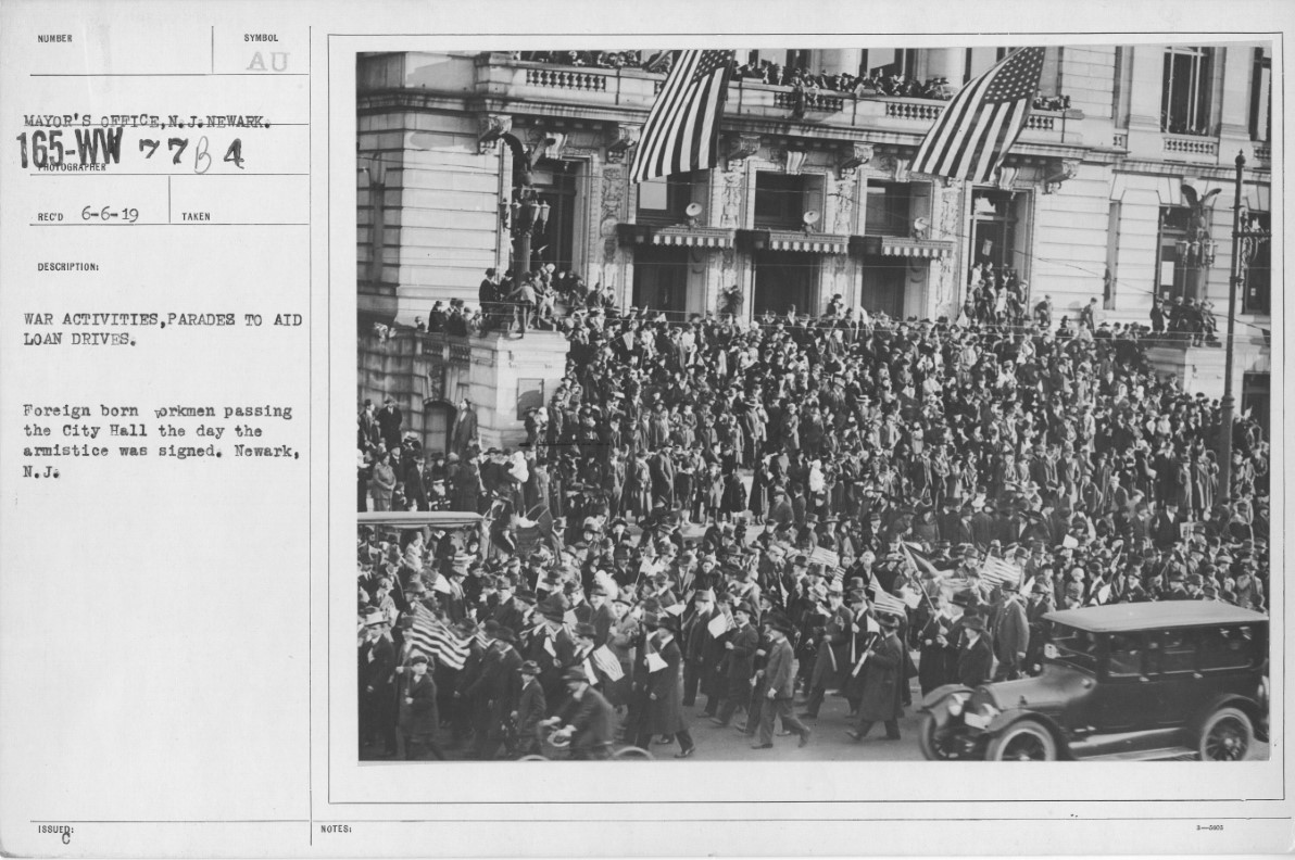 Foreign Born Workmen Passing the City Hall the Day Armisice was Signed
