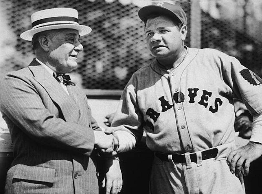 Ruppert & The Babe
circa 1934: American baseball player Babe Ruth (George Herman Ruth, 1895 - 1948), wearing a Boston Braves uniform, shakes hands with Jacob Ruppert, owner of the New York Yankees. Ruth was a player and vice-president of the Braves at that time. 
Photo by New York Times
